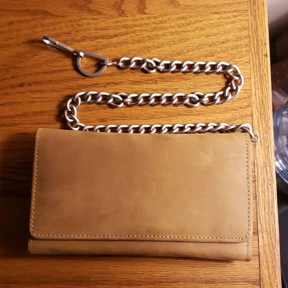 Unbranded tri-fold brown leather wallet with 19